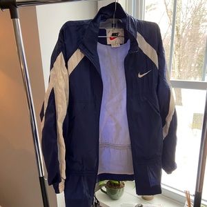 Vintage navy blue Nike windbreaker.